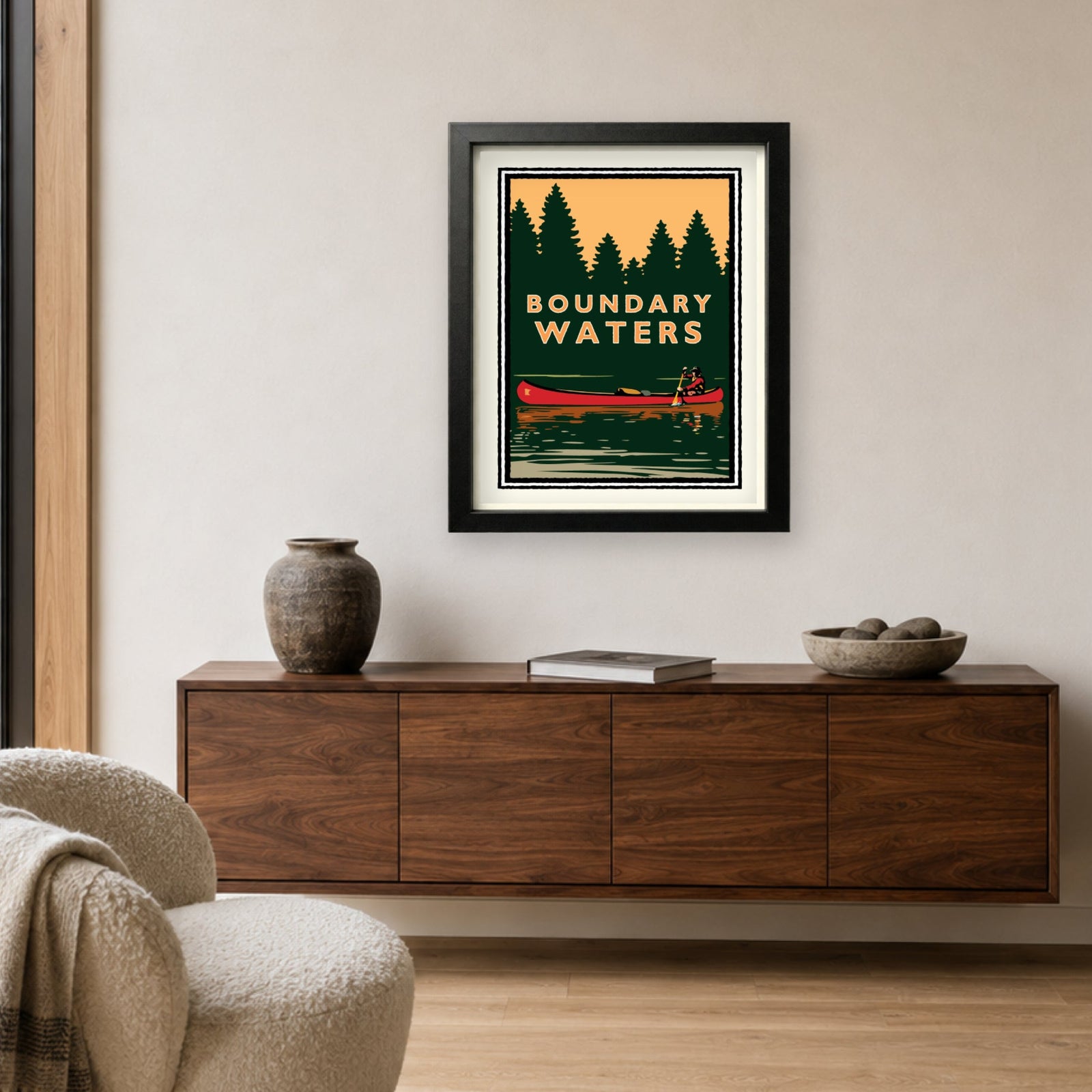 Framed Boundary Waters Canoe Minnesota art print displayed above a modern wood console