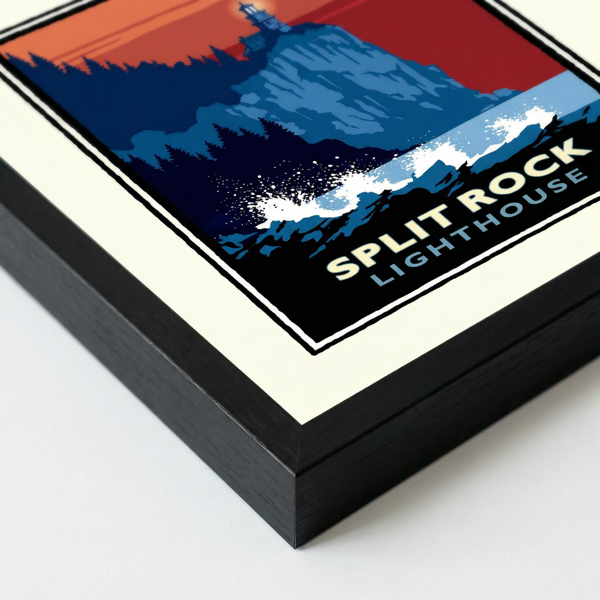 a framed poster or artwork depicting a lighthouse on a rocky cliff, with a sunset in the background.